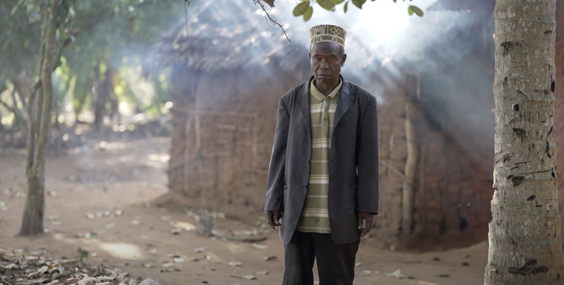 Man stands outside of his home